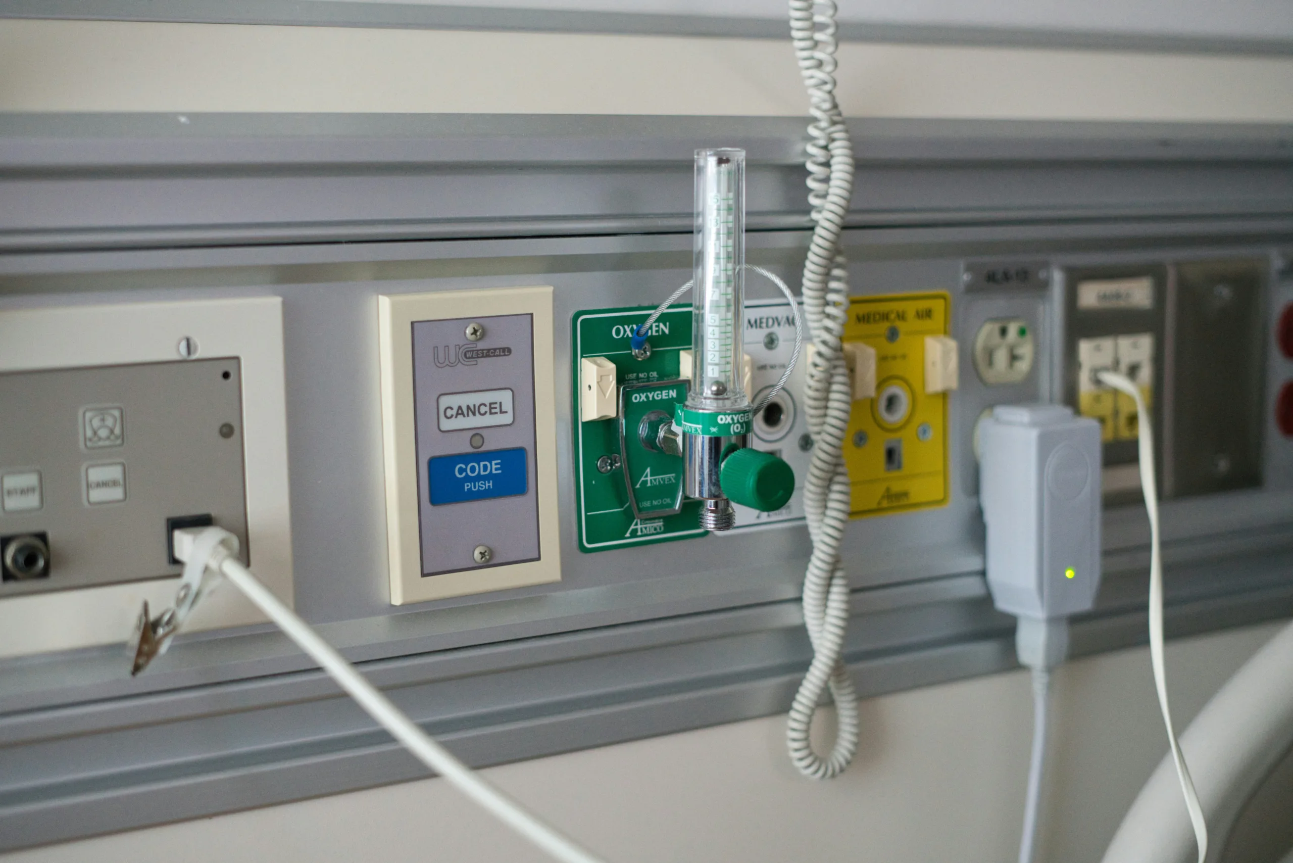 Hospital bedhead panel with medical gas outlets and electrical connections