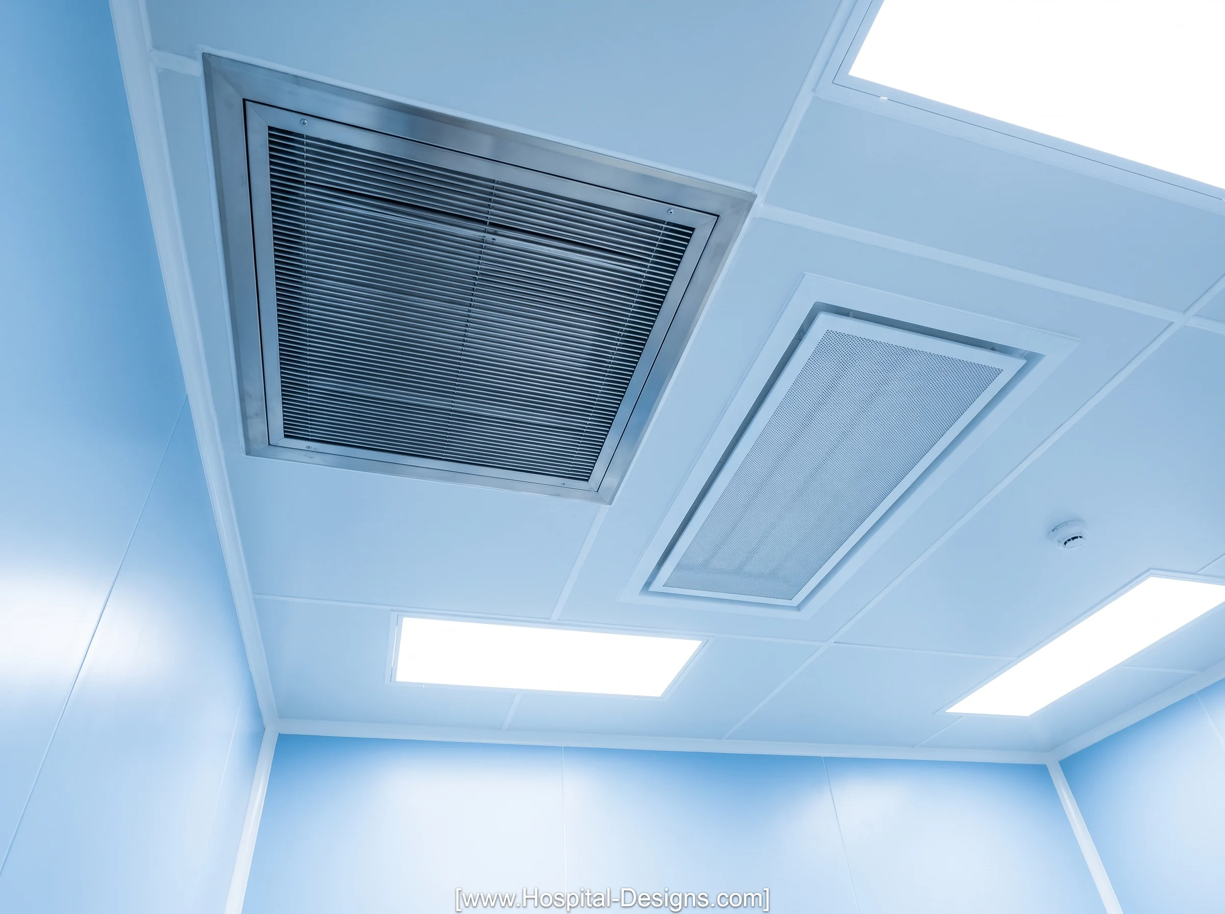 Hospital ceiling showing ventilation grilles, air terminals and integrated lighting panels.